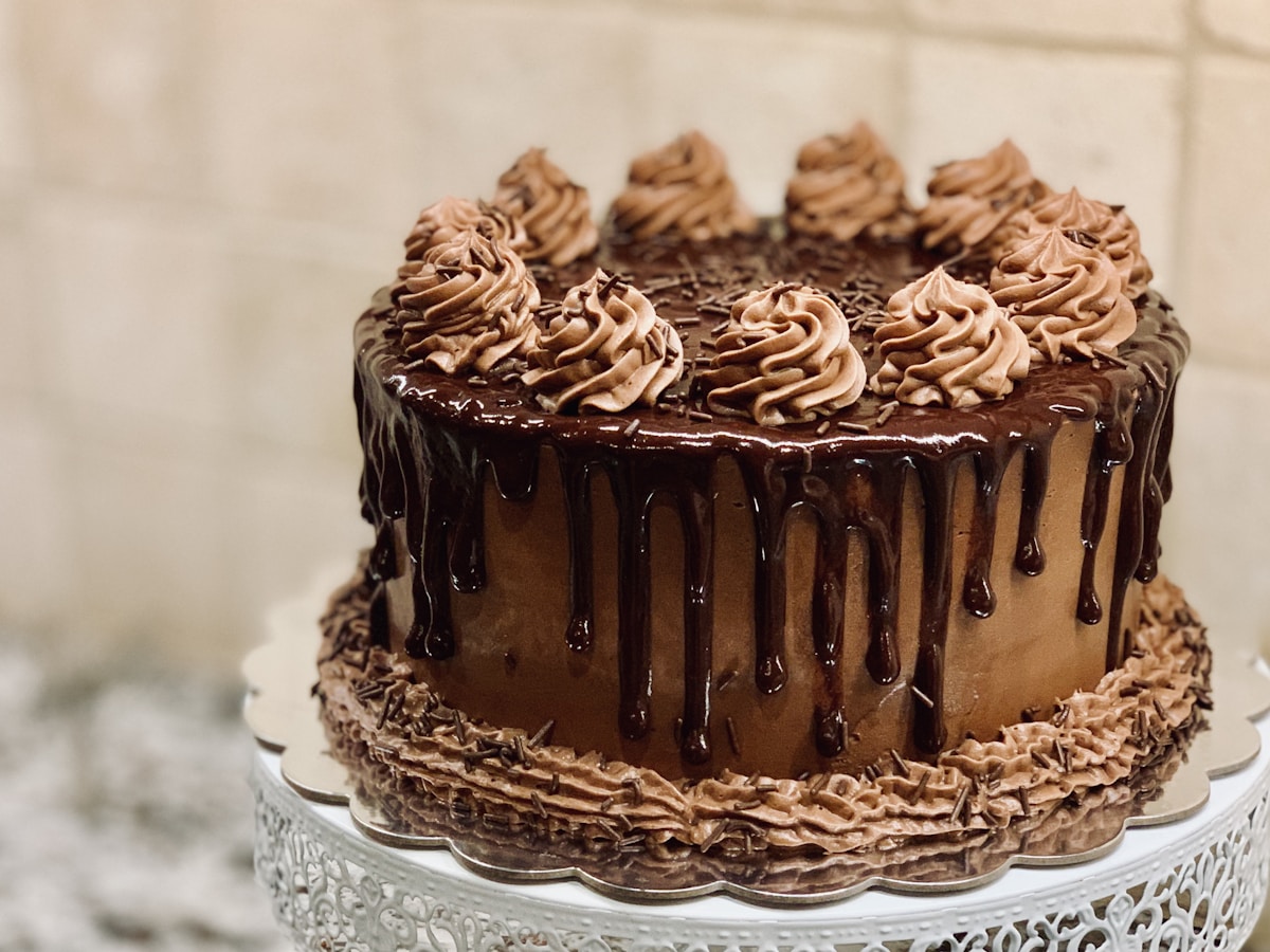 Bakery owner recording a cake order in My Customer on phone